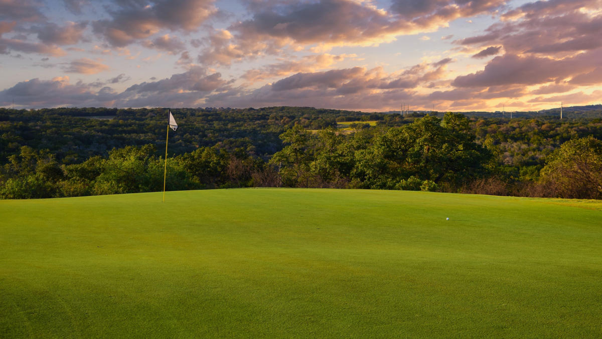 Golf course with dusk in background