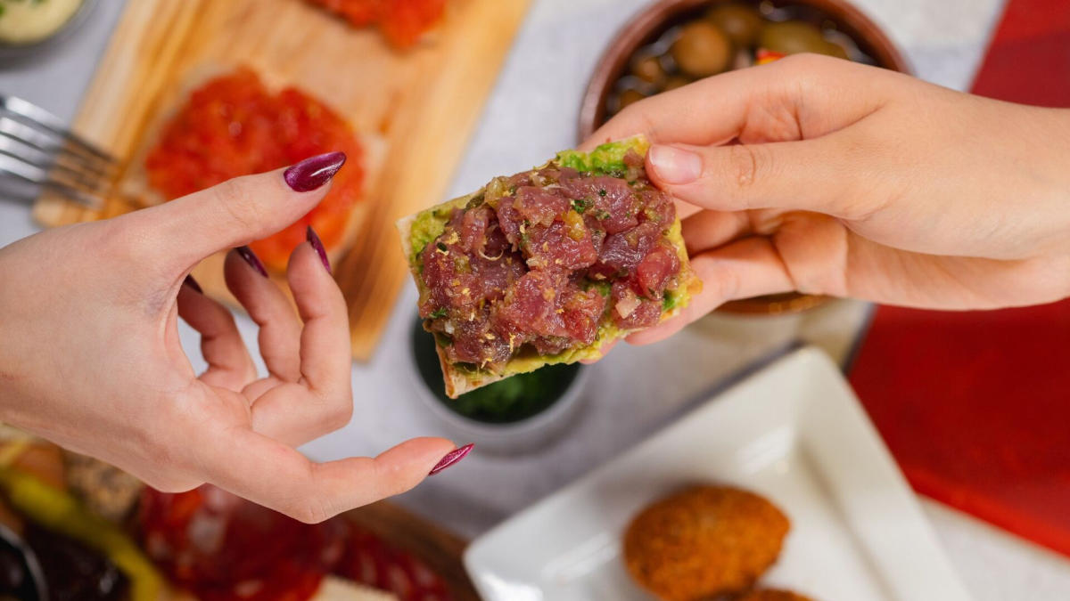 Hands passing food to each other