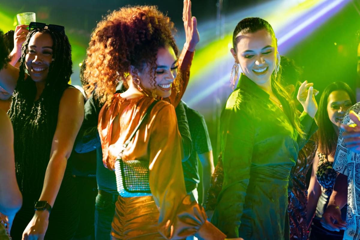 Clubgoers dancing inside nightclub