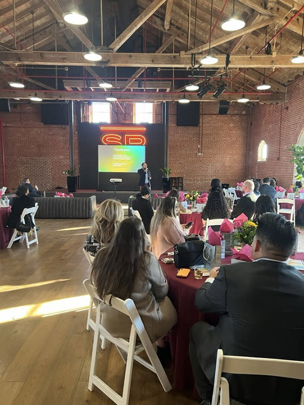 Professionals seated with event chairs