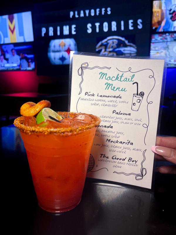 Tropical cocktail in front of drink menu.