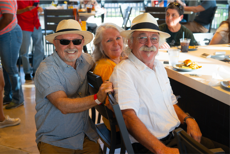 people posing for photo at restaurant