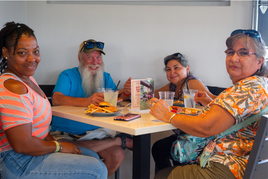 people posing for photo at restaurant