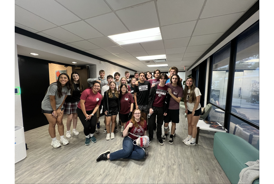 volunteers posing for photo in office