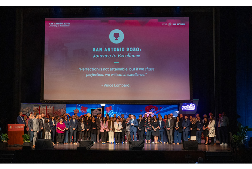 Group of people gathered onstage