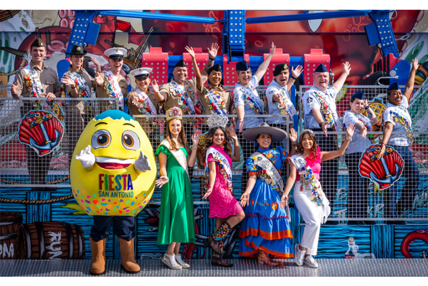 Group of people smiling and posing with costumed cascarone.