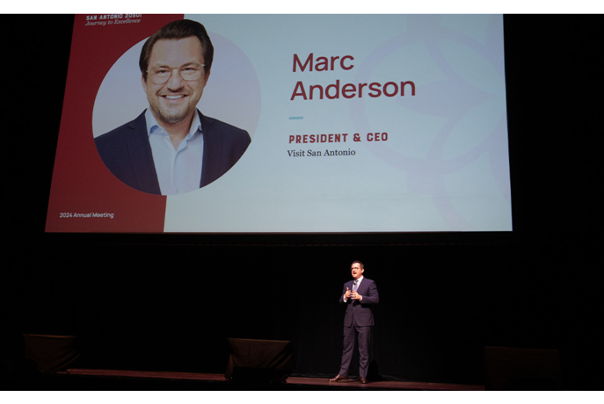 Man onstage talking