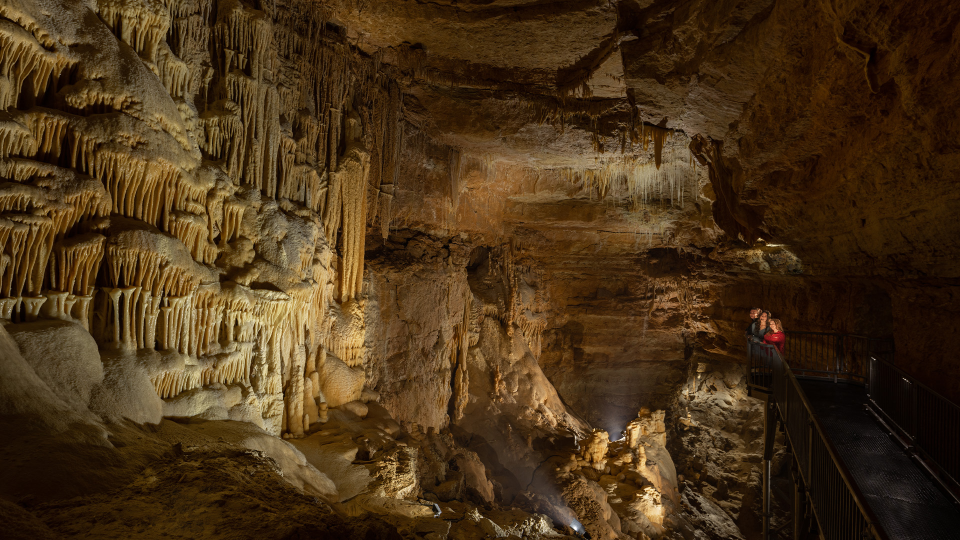 Family looking at caves inside Natural Bridge Caverns.