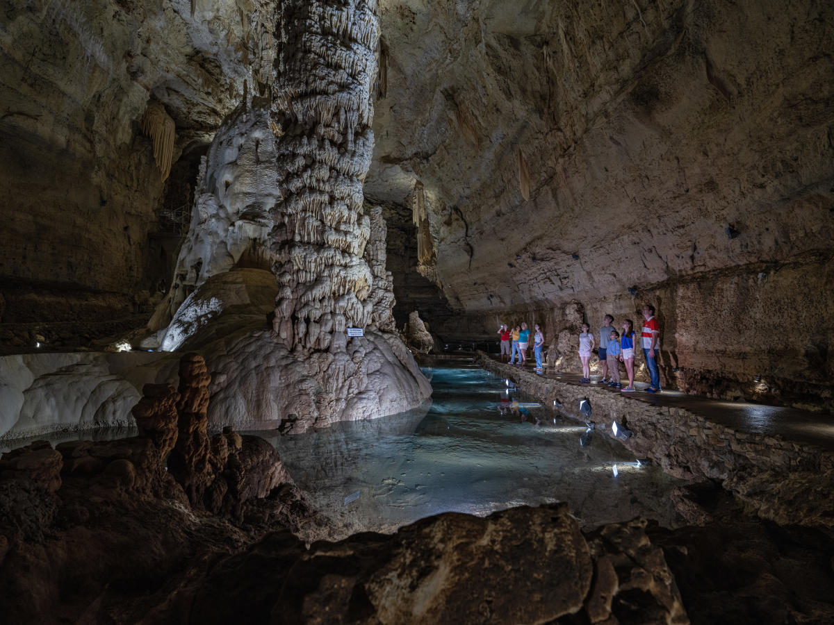 People inside caverns staring at caverns at Natural Bridge Caverns.