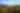 a mountainside filled with colorful trees