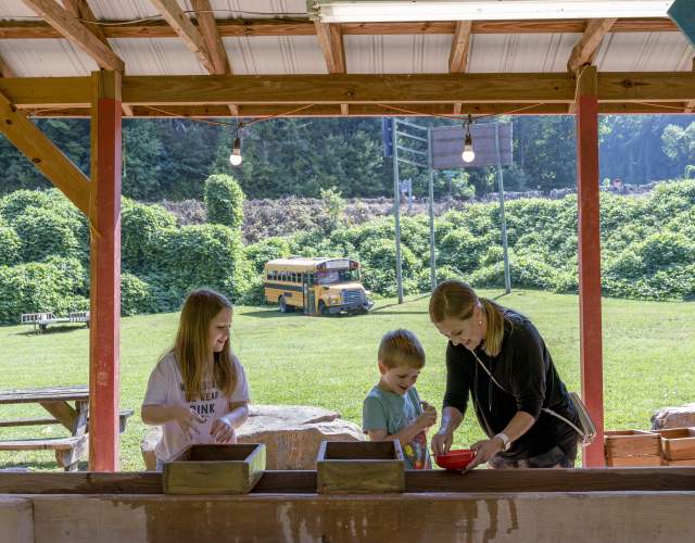 Woman and children mining gems