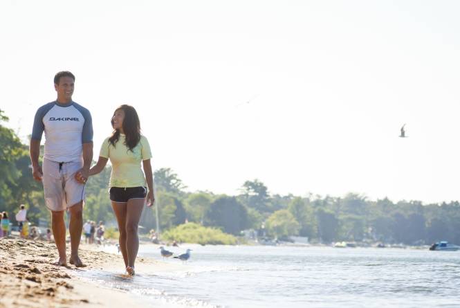 Couple walking along beach at TC State park