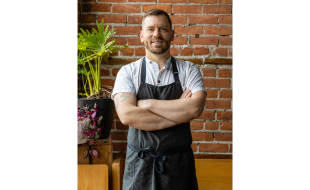 Full body shot of chef Cameron Rolka