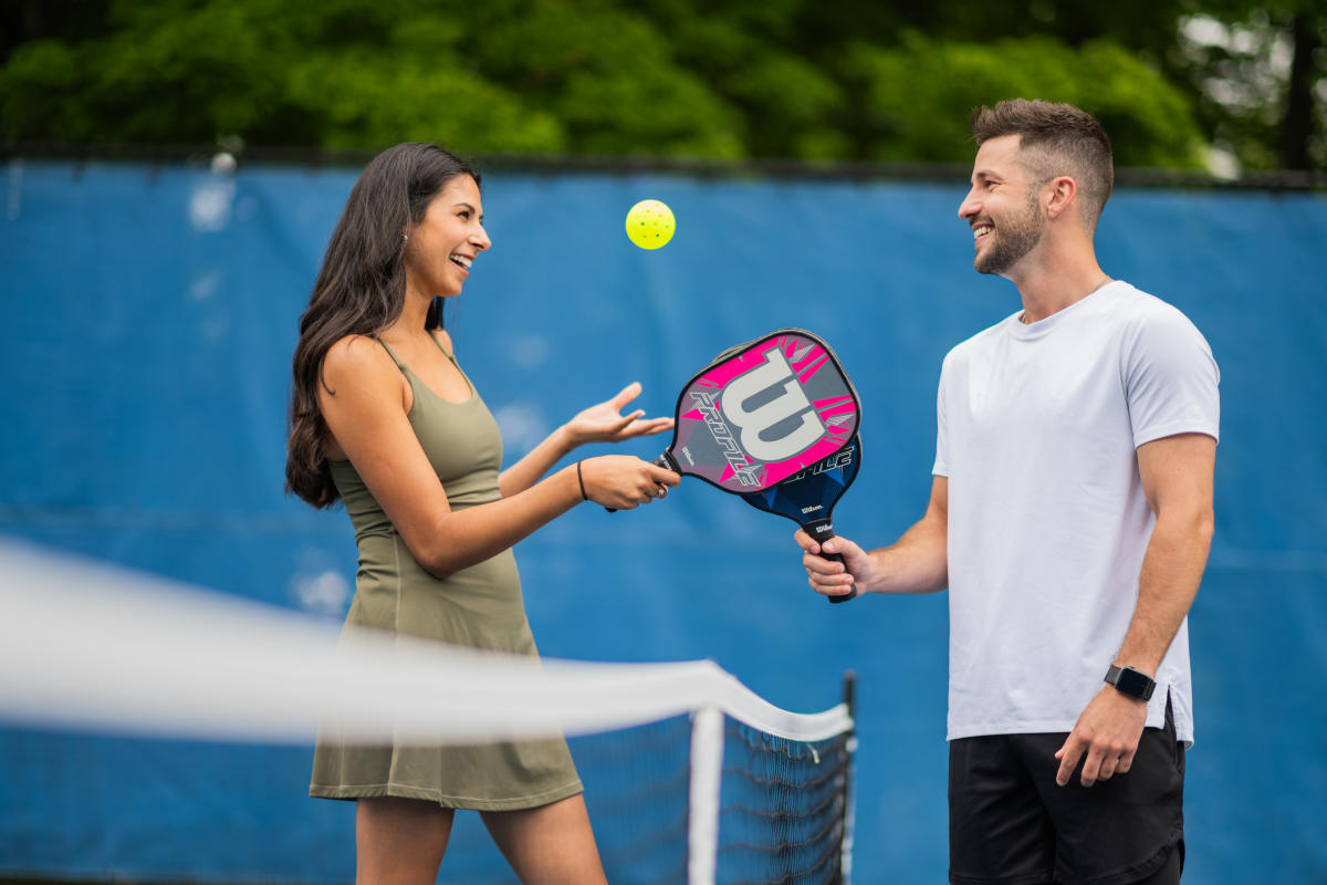 Couple playing pickleball at the Grand Traverse Resort and Spa