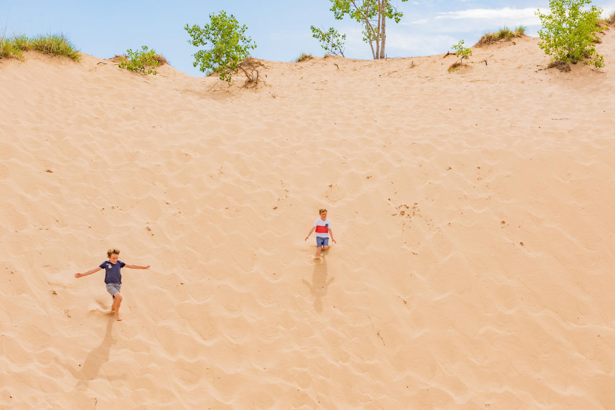 Kids running down Sleeping Bear Dunes