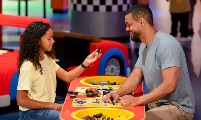 Parent and child play with the blocks at LEGOLAND Discovery Center in Plymouth Meeting