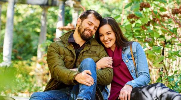 Happy couple sitting in the nature