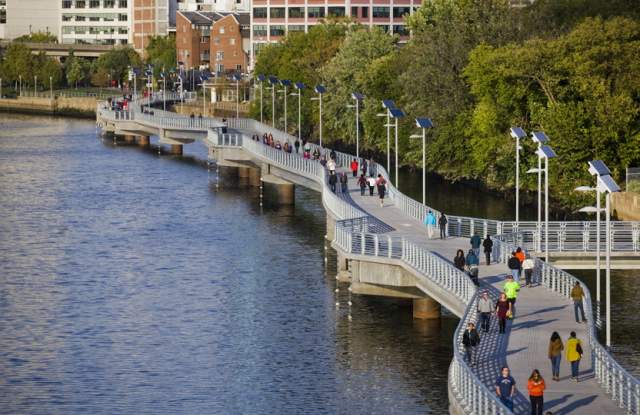 People walking and riding on the Schuylkill River Trail in Philadelphia