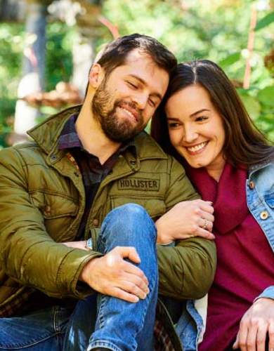 Happy couple sitting in the nature