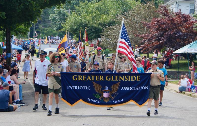 Individuals walk in the Glenside July 4 Parade - 2024