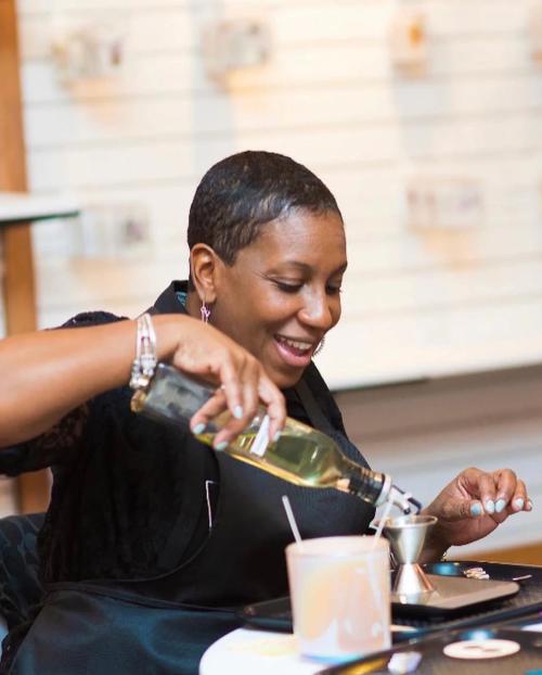 Female makes a candle at Love n Honey Candle Co