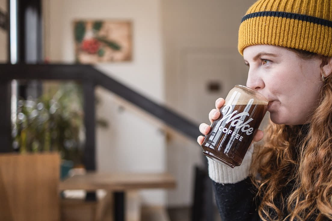 Woman drinking Wake coffee