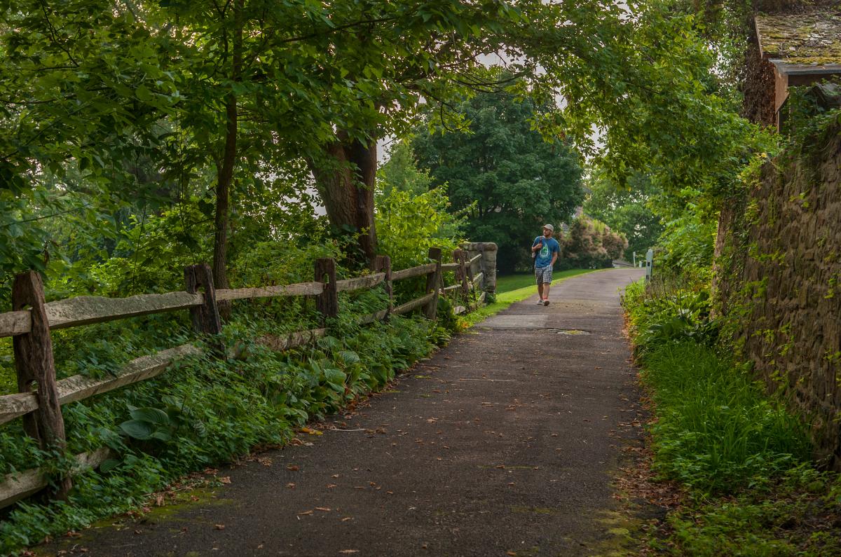 A runner on the trail at John James Audubon Center