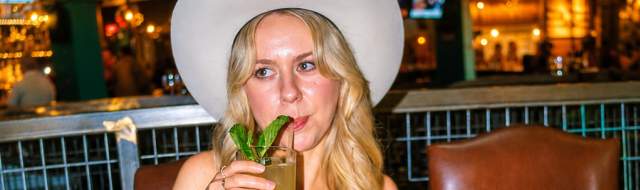 girl in cowboy hat enjoying dinner