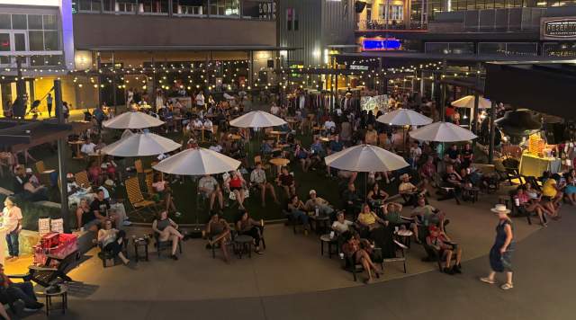 People enjoying the night time market and events