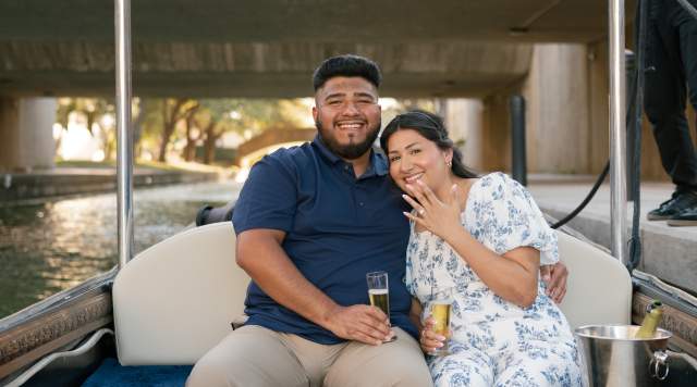 Showing off her ring after the proposal