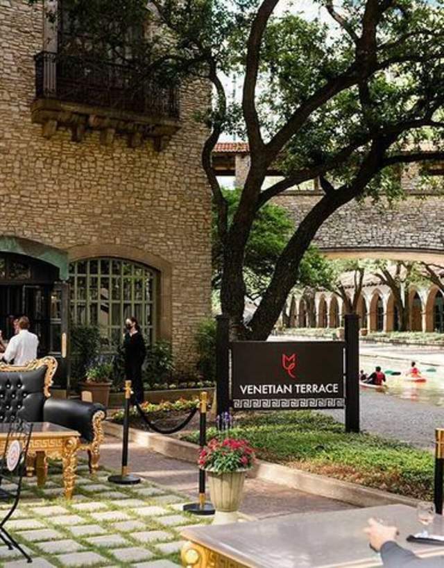 The exterior of Venetian Terrace with the Mandalay Canal in the background in Irving, TX