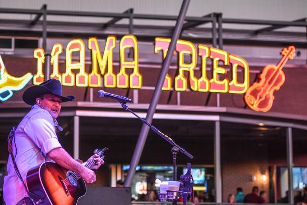Music artist playing the guitar at Mama Tried in Irving, TX