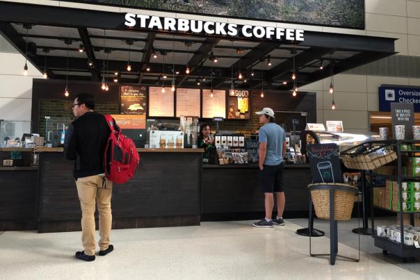 People enjoying Starbucks At DFW Airport