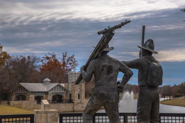 Bronze statue of The Founders of Irving, Texas outside the Irving Public Library