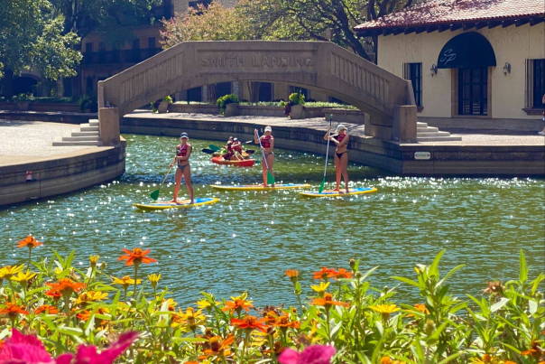 People paddle boarding near Lake Carolyn In Irving, TX