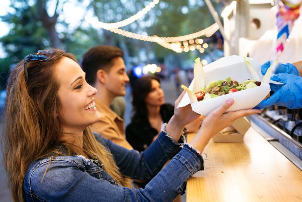 Woman holding Tacos