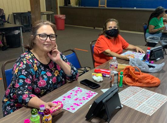 Betcha Bingo, woman holding Bingo daub