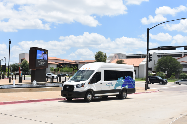 The van parked outside of the Irving Convention Center