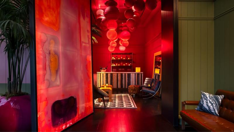 Red lighting and romantic ambiance in the Irving restaurant, Knife Italian Steak