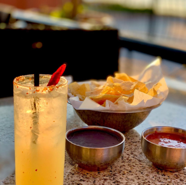 A cocktail along with chips and salsa at Gloria's Latin Cuisine in Irving, TX