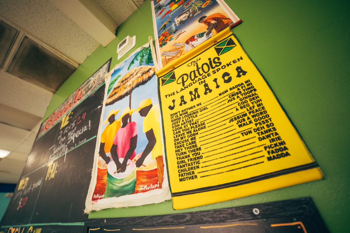 Sign with Jamaican slangs written all over it at Roland Jamaican Chicken