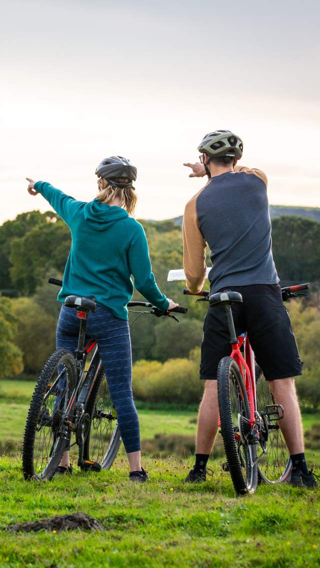 Two people cycling near Corfe Castle in Dorset