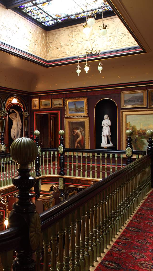 Art and paintings on the balcony at Russell-Cotes Art Gallery and Museum in Bournemouth, Dorset