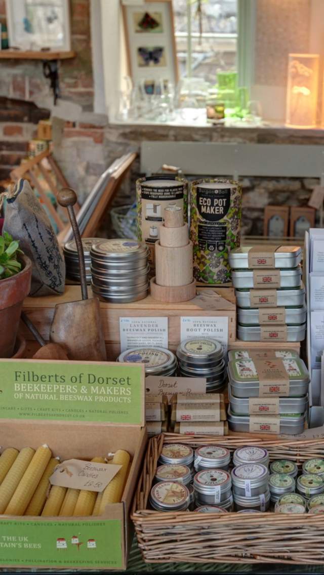 candles, and other goods on a table in a local shop