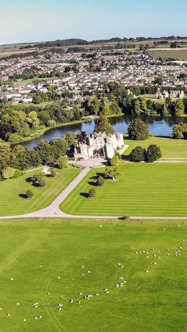 An aerial view over the old and new castle at Sherborne