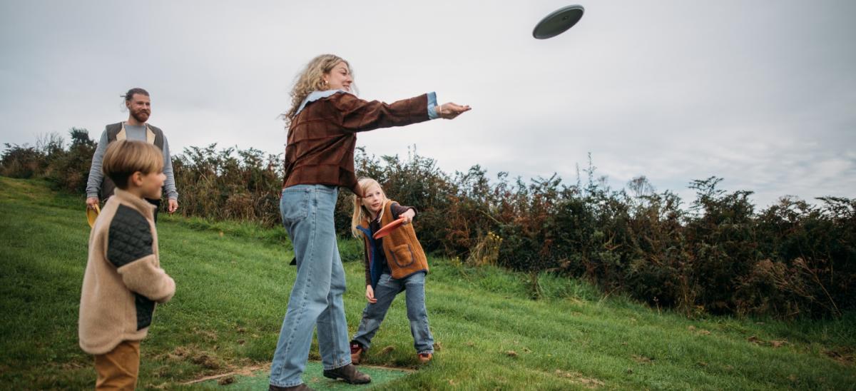 A family playing disc golf at Bowleaze Cove Holiday Park in Dorset