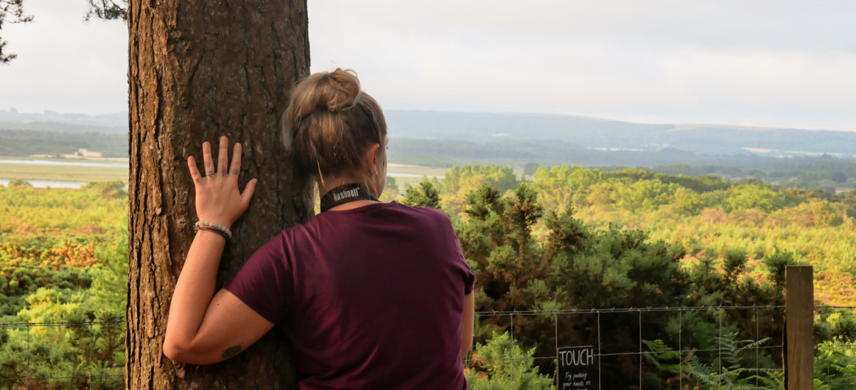 Girl looking out over Arne Nature Reserve