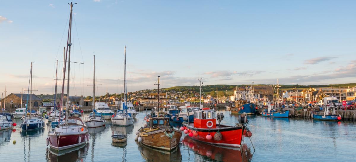 The harbour with colourful fishing boats at West Bay in Dorset © Diana Jarvis